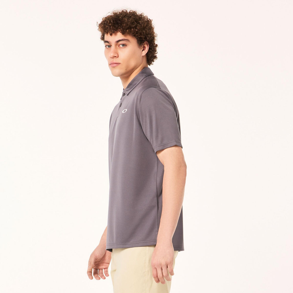 Men's dark gray polo shirt side view with collar and Oakley logo