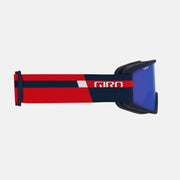 Semi snow goggles with blue lens and red-and-white banded strap, angled view