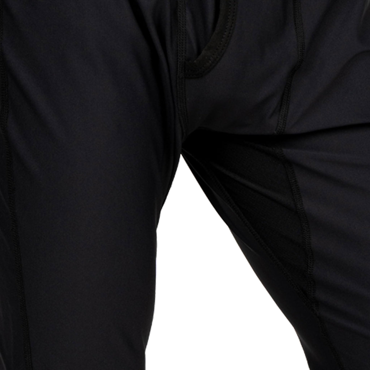 Black base layer fabric close-up with curved panel stitching