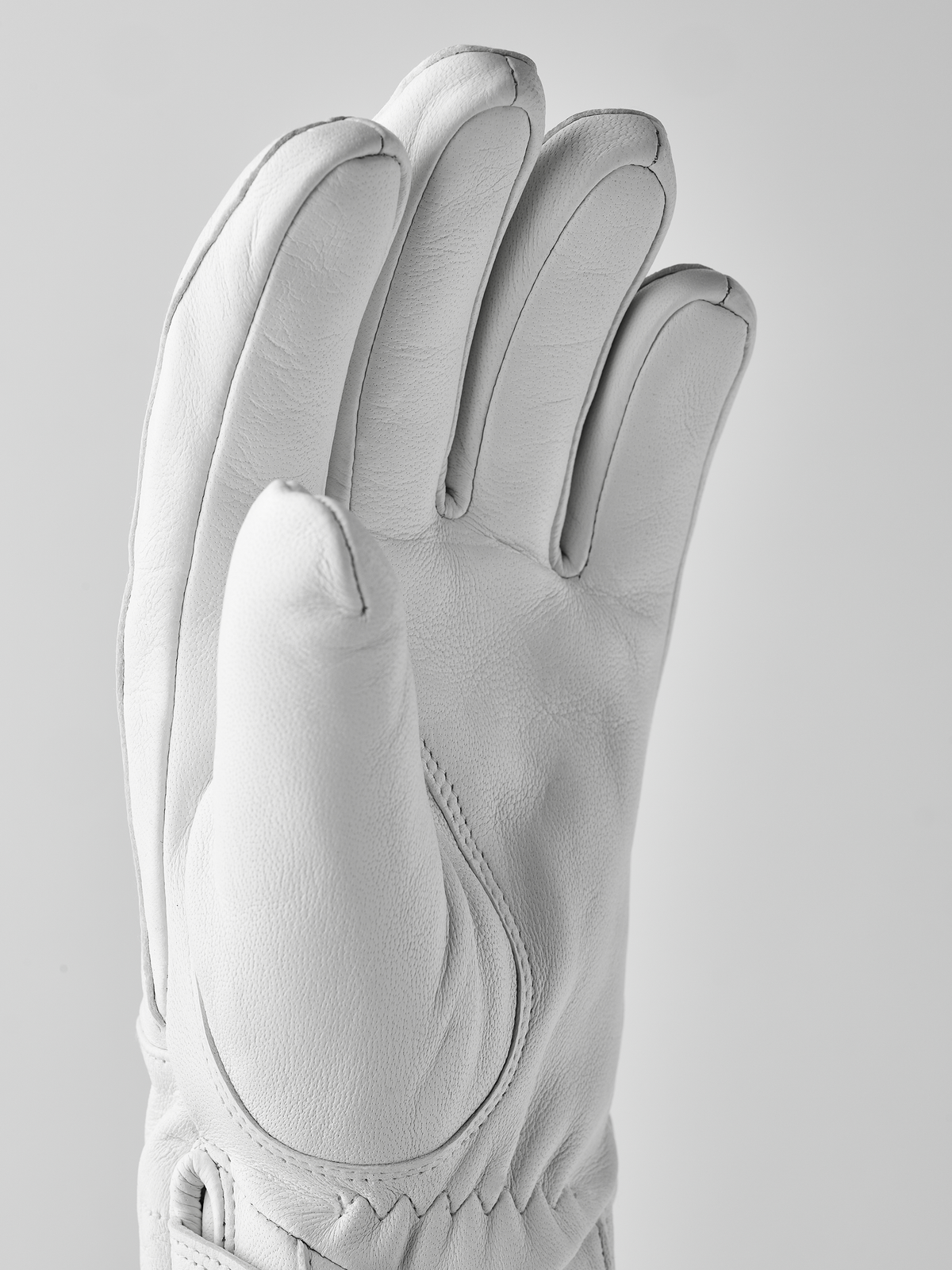 White wool gloves with five fingers and stitched back panel seam detail