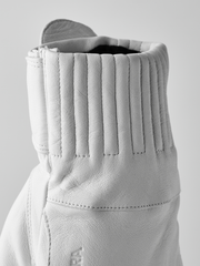 White leather gloves with vertical ribbing at cuff and stitched wrist seam