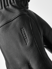 Black wool gloves with embroidered logo on back and diagonal seam detail