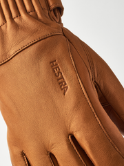 Tan wool gloves with embroidered brand logo and diagonal stitched finger panel
