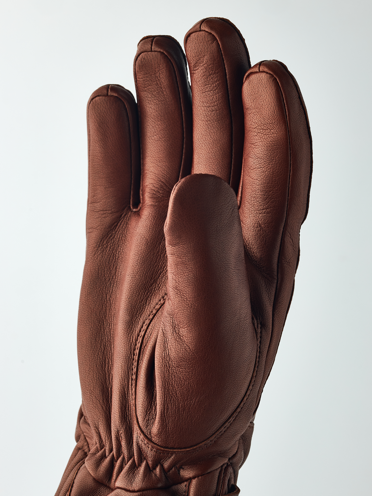 Brown Hestra Idre wool gloves with padded palms and gathered cuff stitching