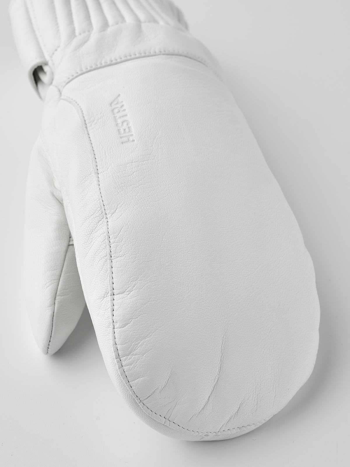 White wool mittens with textured leather palm and stitched side seams