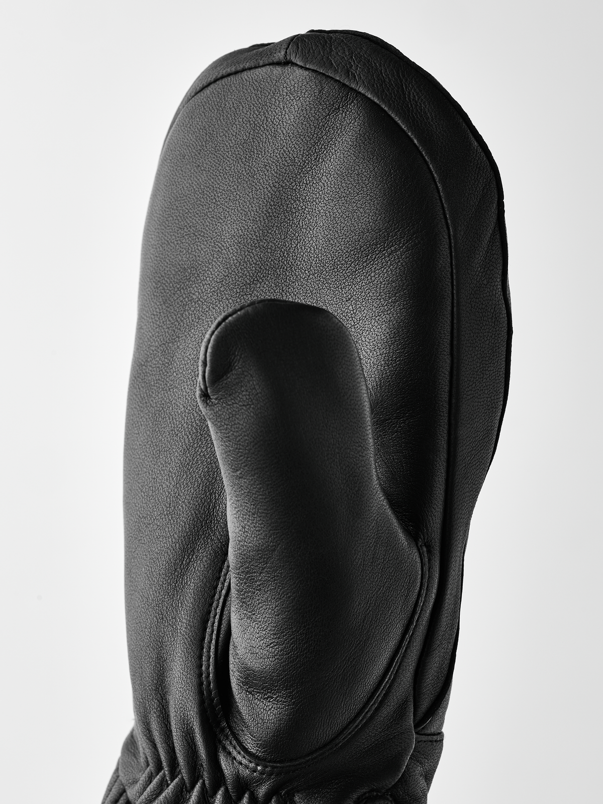 Black wool mittens with contoured palm panel and stitched thumb section