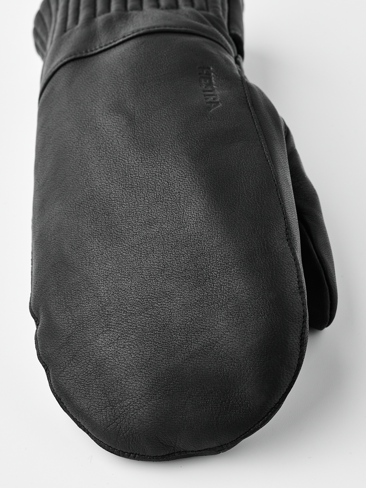 Black wool mittens with textured leather-look palms and elastic wrist cuff