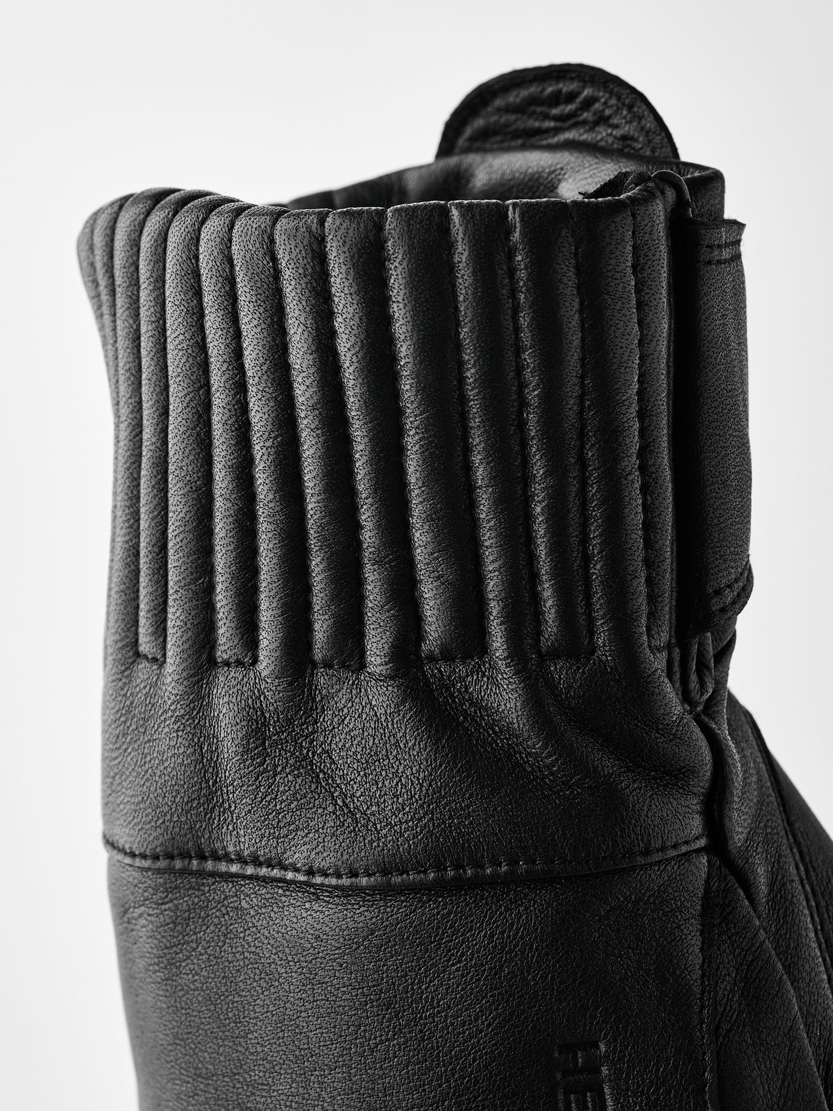 Black wool mittens with ribbed cuff detailing and stitched hand panel