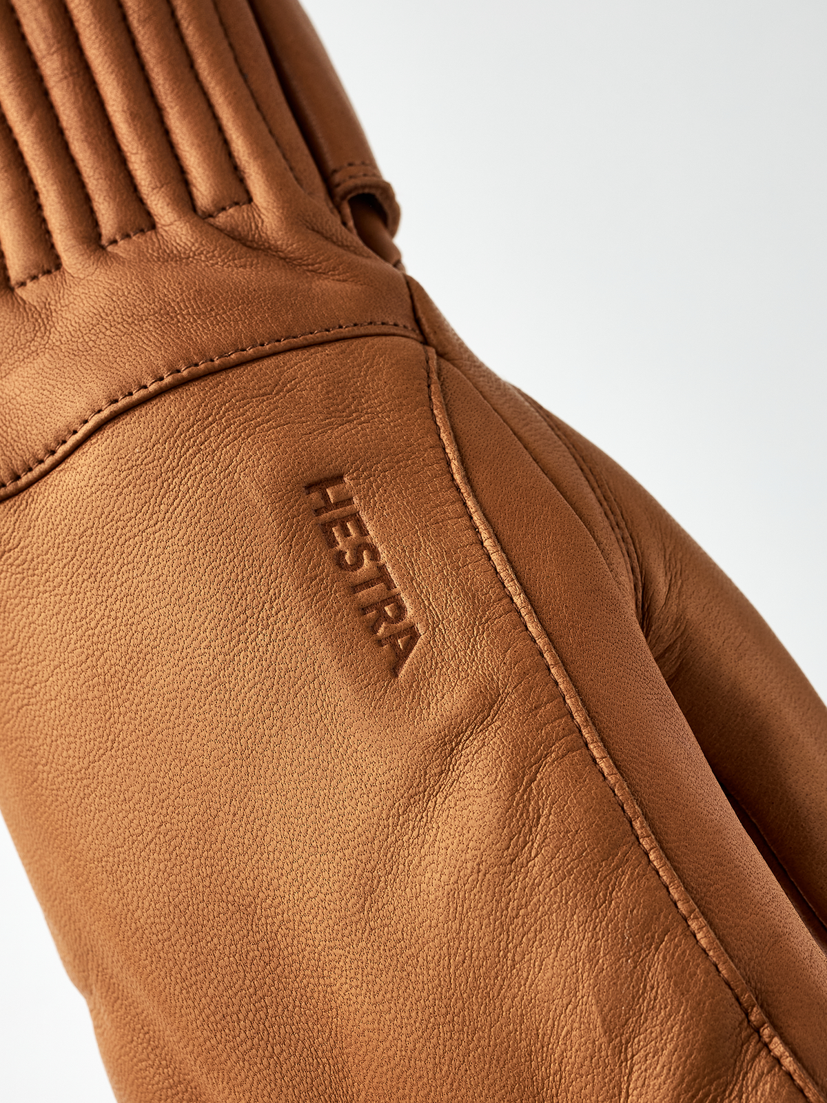 Cork brown wool mittens detail, Hestra logo stitched on leather palm panel