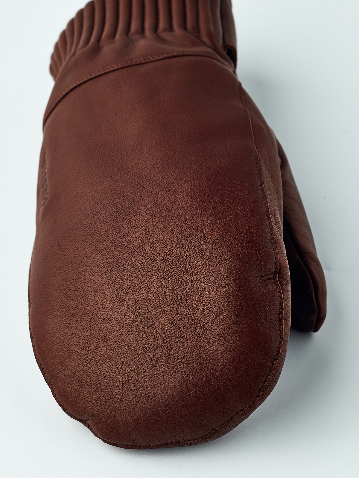 Brown wool mittens with textured leather-look palms and ribbed knit wrist cuff