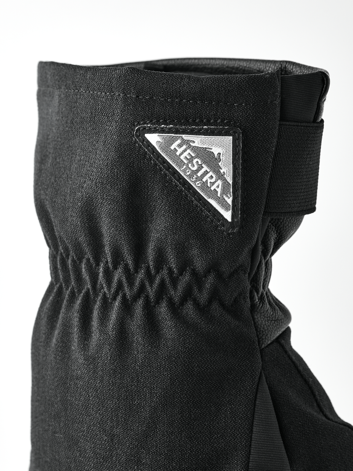 Black powder short glove with strap cuff and Hestra logo patch