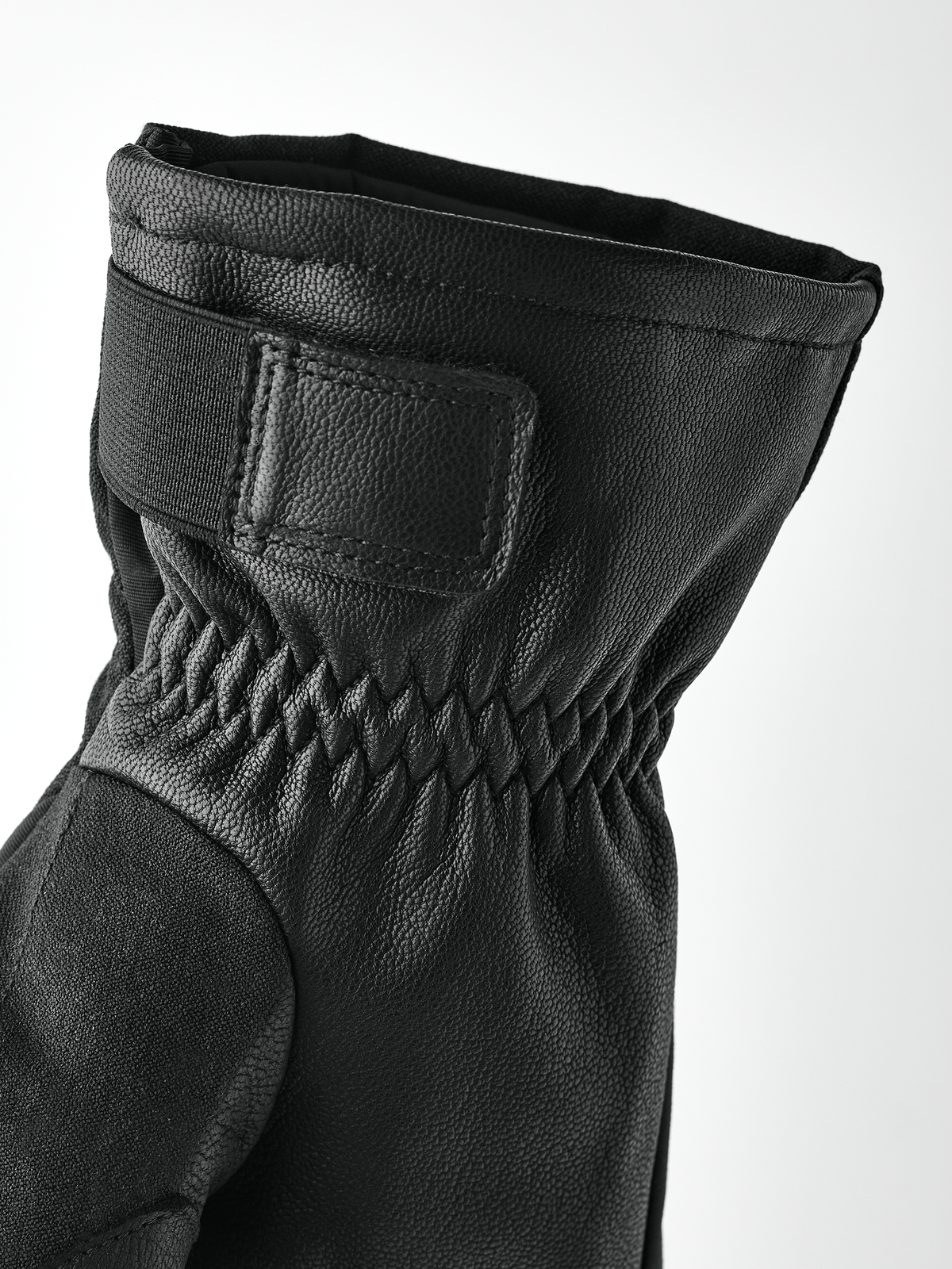 Black powder short gloves with leather strap cuff and quilted wrist