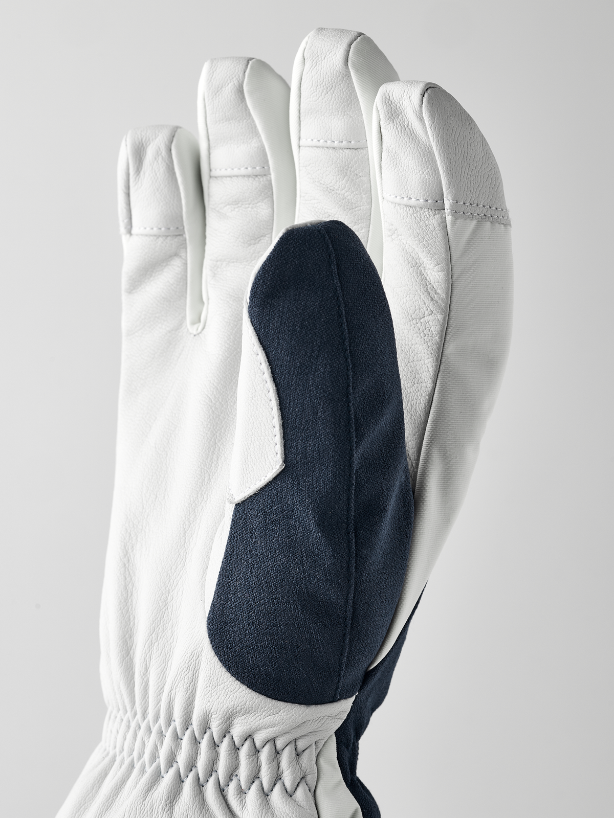 White short gloves with navy panel on back of hand