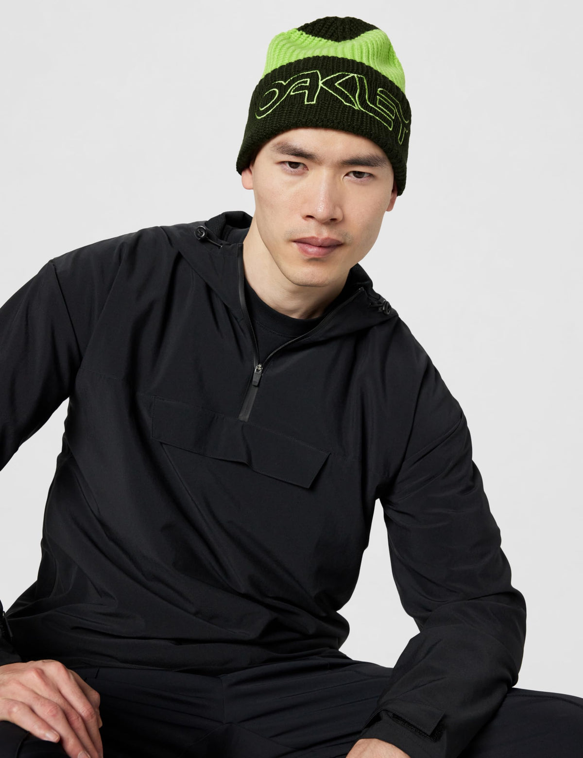 Lime green and dark green ribbed beanie with Oakley logo, worn