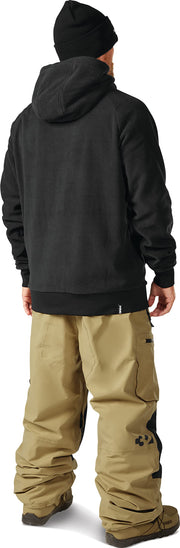 Men's snow sport pants in tan with cargo pockets and adjustable bottom cuffs
