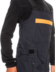 Boys' insulated snowboard bib overalls, dark close-up with orange chest pocket and zipper