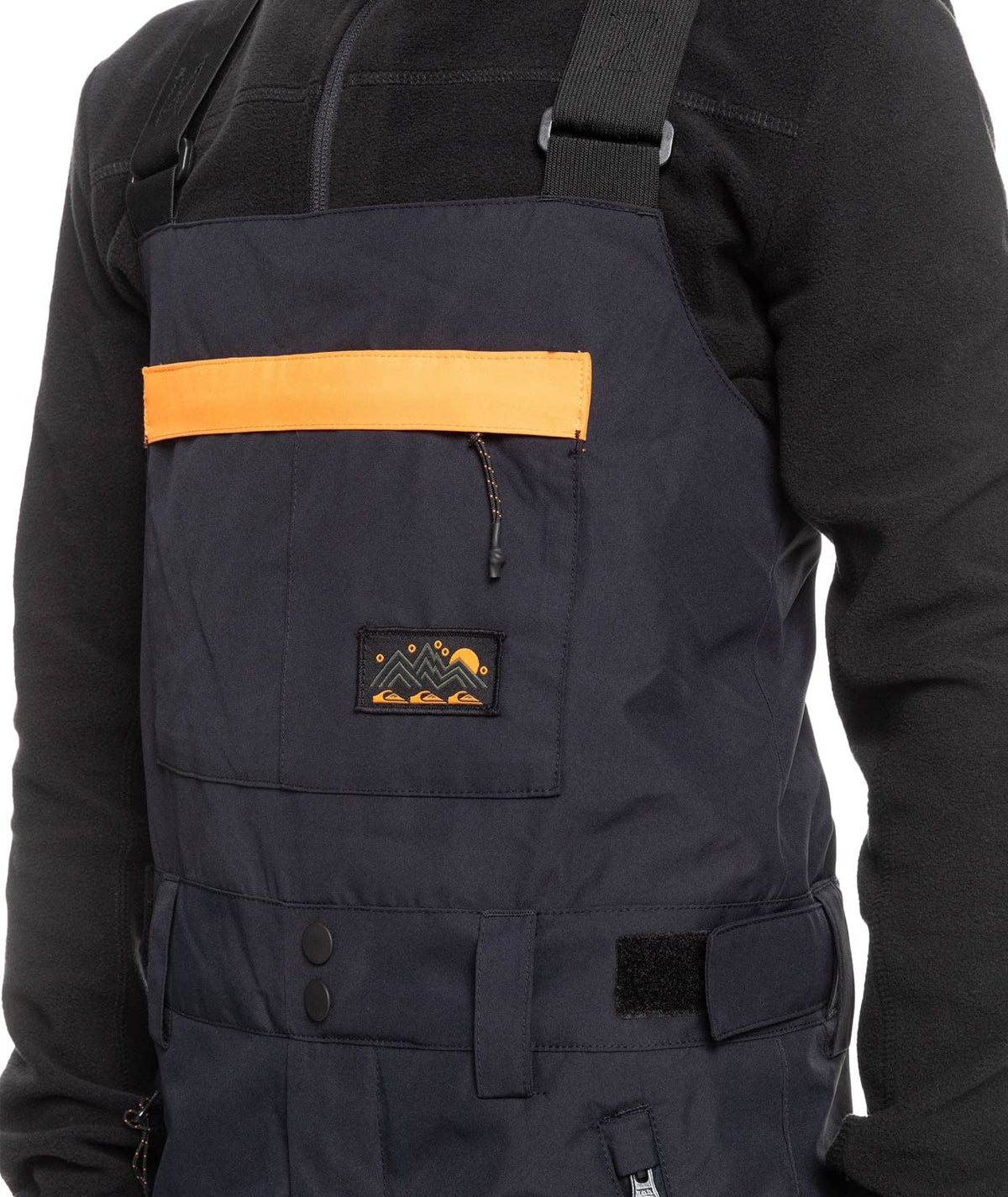 Boys' insulated snowboard bib overalls, dark front pocket with orange accent panel