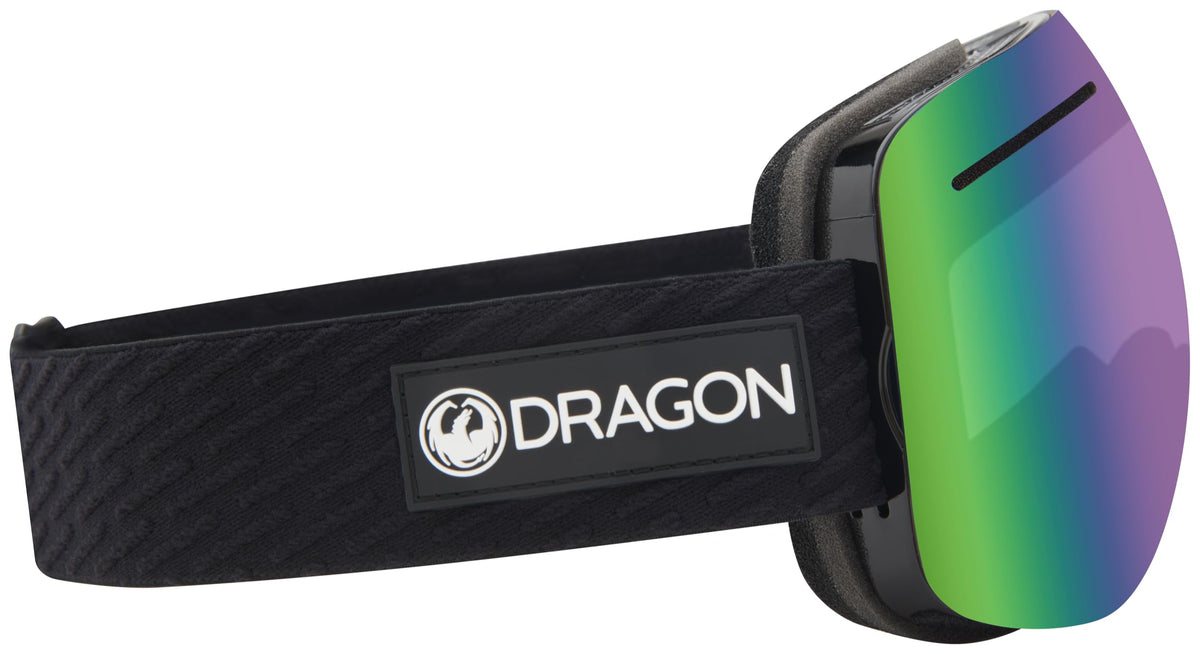 Snow goggles with wide green mirrored lens and DRAGON logo on black strap