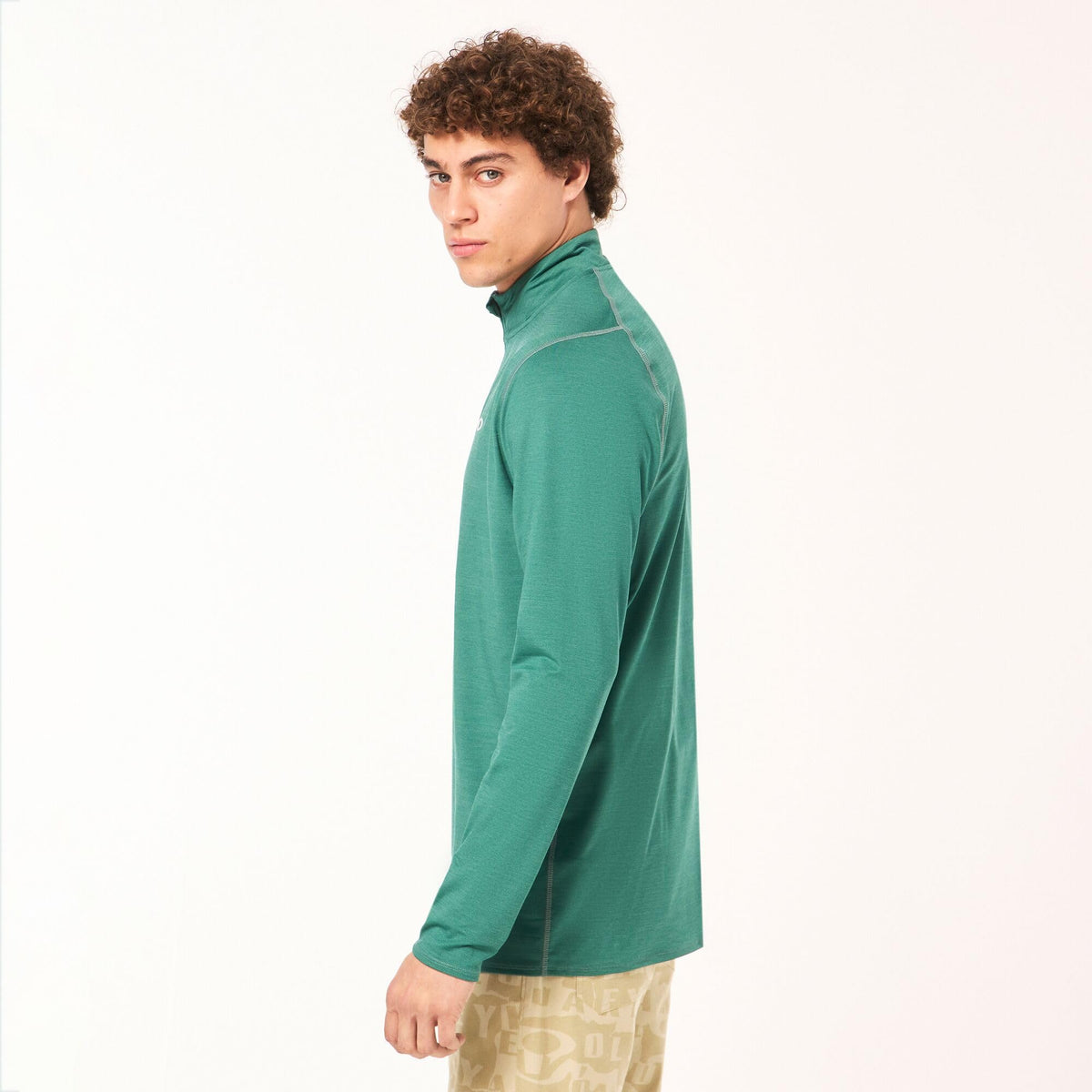 Green quarter-zip sweatshirt worn by model; long sleeves, side profile
