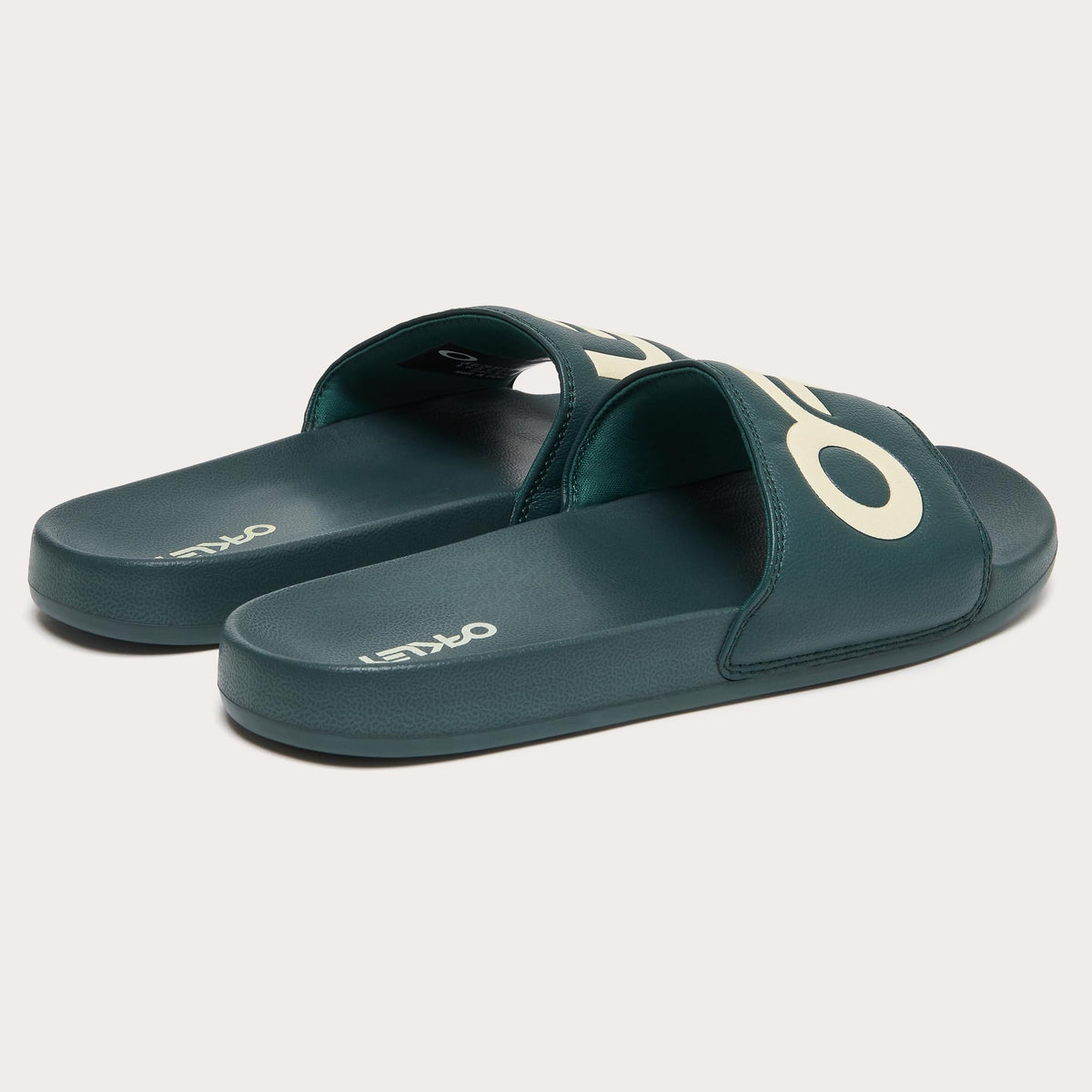 Men's slide sandals, dark teal with white Oakley logos on footbed and strap
