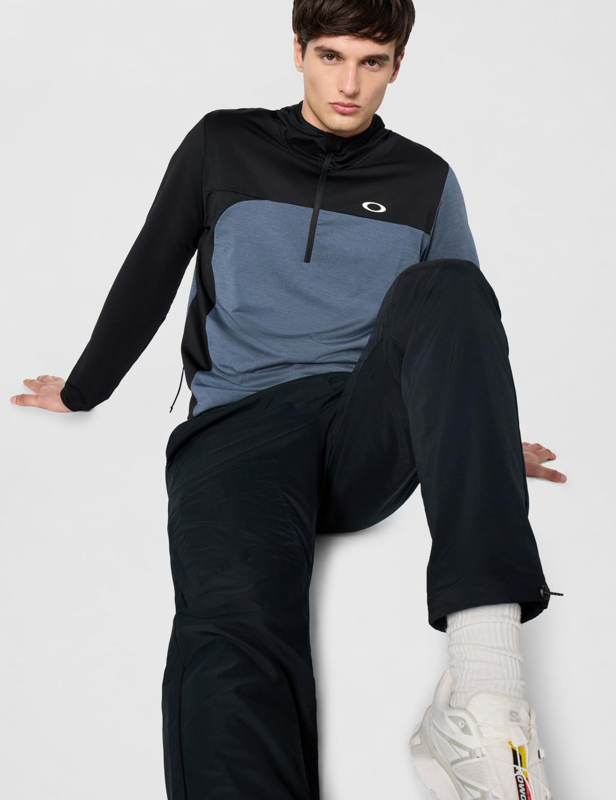Men's two-tone zip-up hoodie with black sleeves and blue heather chest panel, hooded