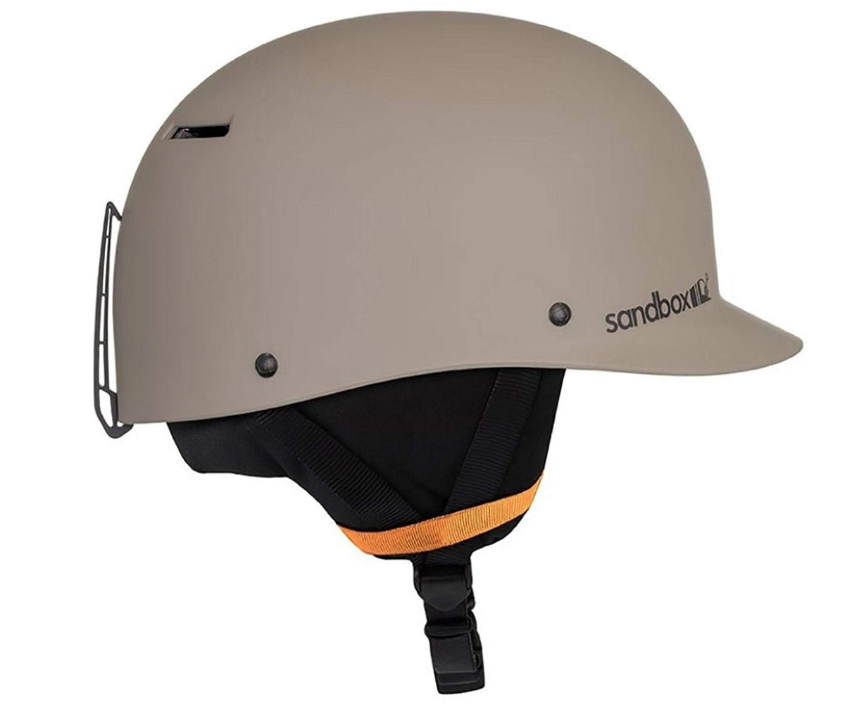 Matte taupe snow helmet with black ear pads and orange inner lining