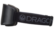 Black snow goggles with smoky lens and DRAGON logo on wide OTG strap