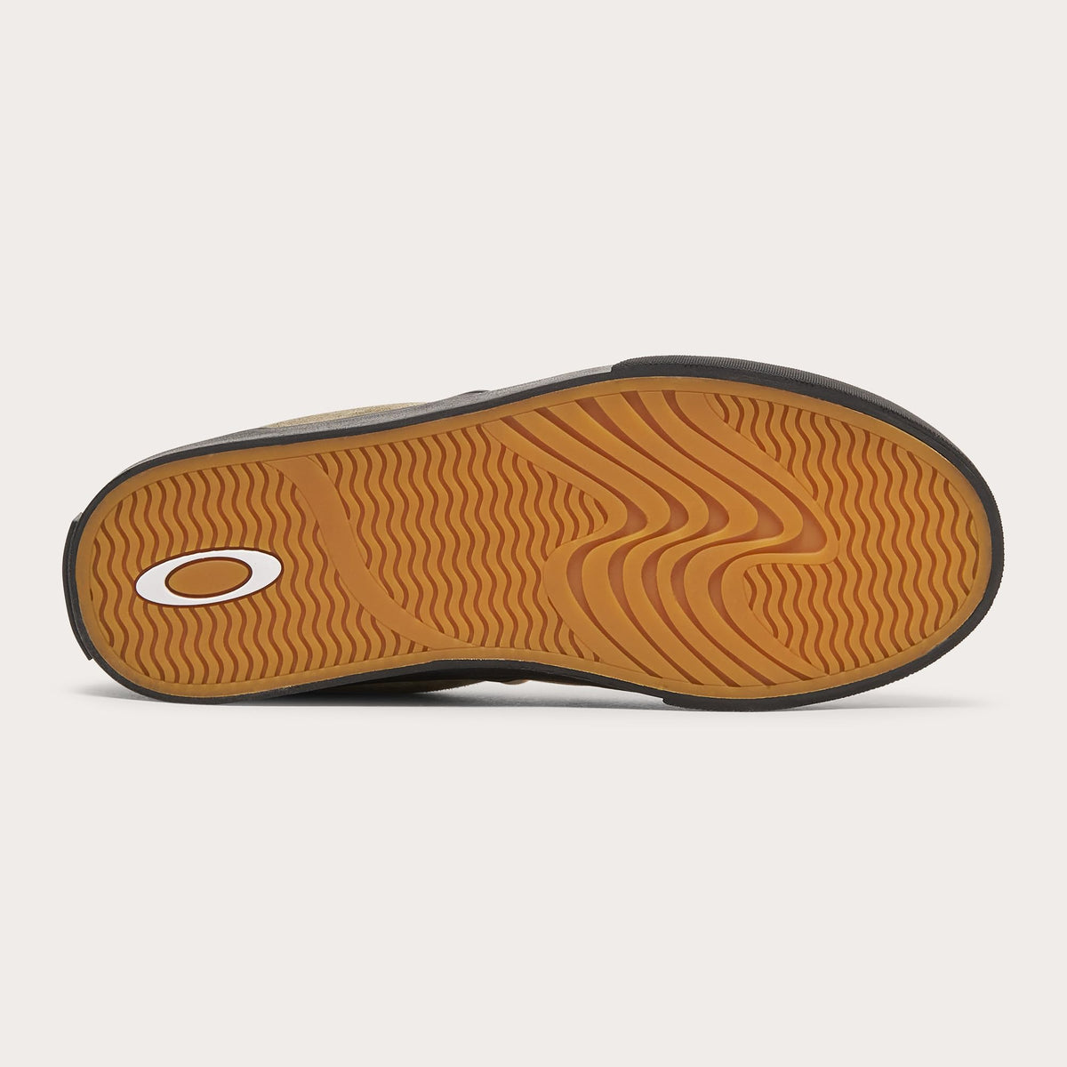 Suede slip-on sneaker outsole with textured pattern and tan tread, black edge