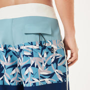 Men's Oakley 19-in board shorts close-up, light blue and navy abstract print with flap pocket