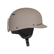 Matte beige snow helmet with black chin strap and Sandbox logo; low-profile fit.
