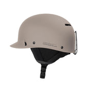 Matte beige snow helmet side profile with vent openings and chin strap.