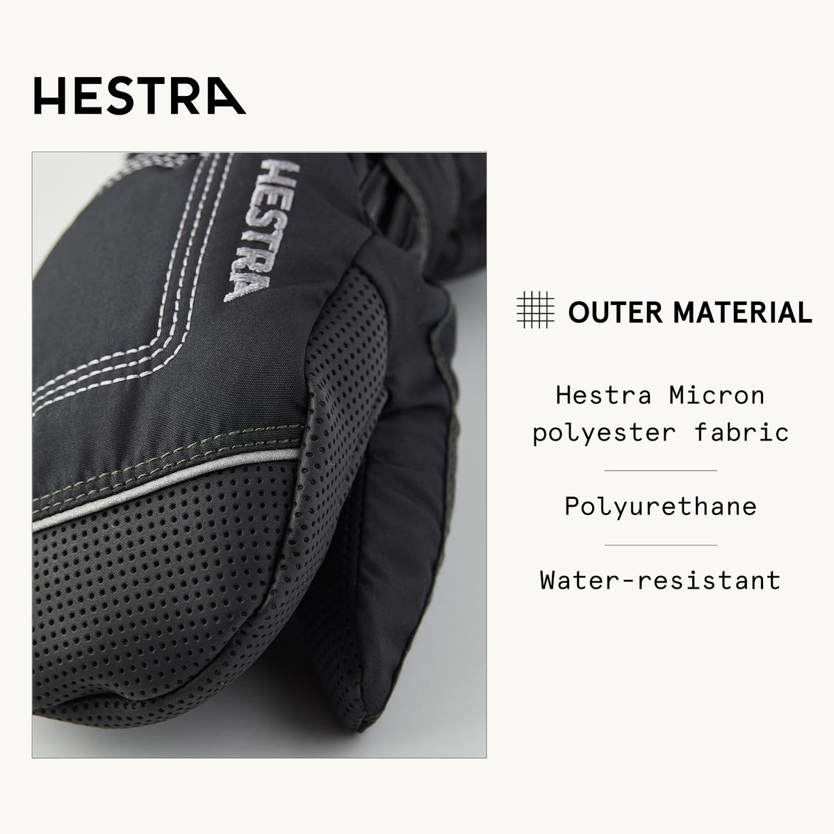 Close-up of black baby long mitt with perforated palm panels and stitched trim