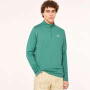 Green quarter-zip sweatshirt worn by model; stand collar and chest logo