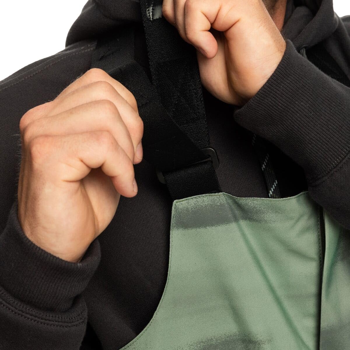 Green bib pocket detail with black front overlay and drawcord adjuster