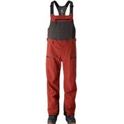 Men's snowboard bibs with black upper and red legs, adjustable suspenders