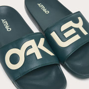 Men's slide sandals, teal straps with bold white Oakley letters and stitched edge