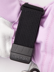 Hestra Heli ski gloves in white with light purple panels and black wrist strap with logo