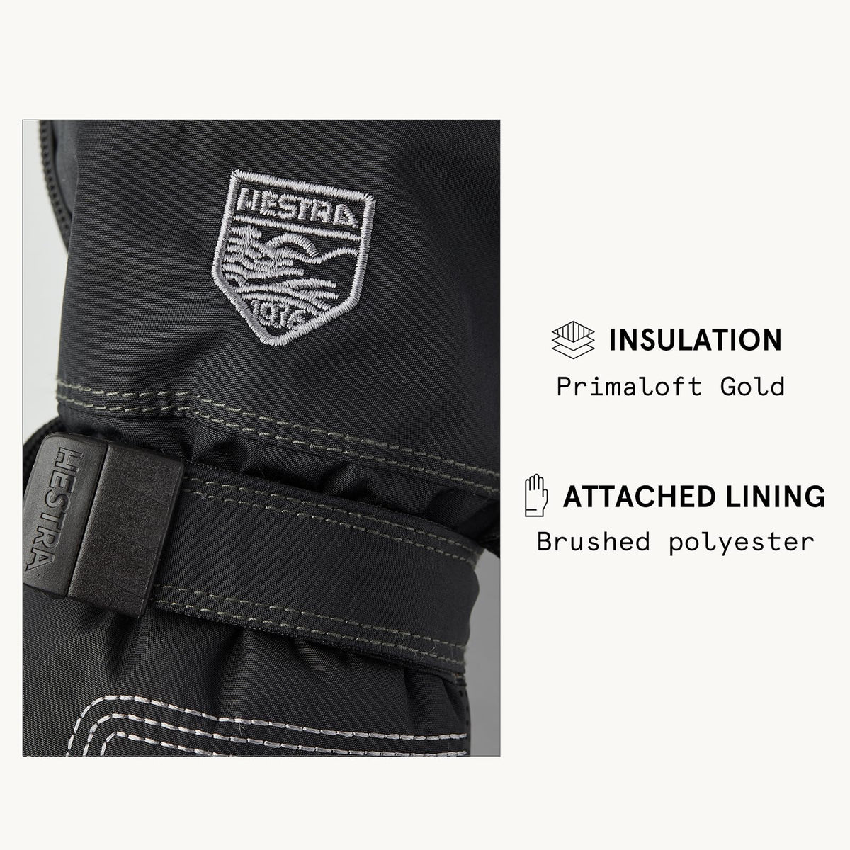 Black insulated baby long mitt with logo patch and wrist strap with hook-and-loop