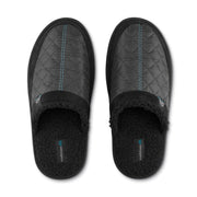Black mule slipper with quilted upper, blue stitch trim, and fuzzy interior lining