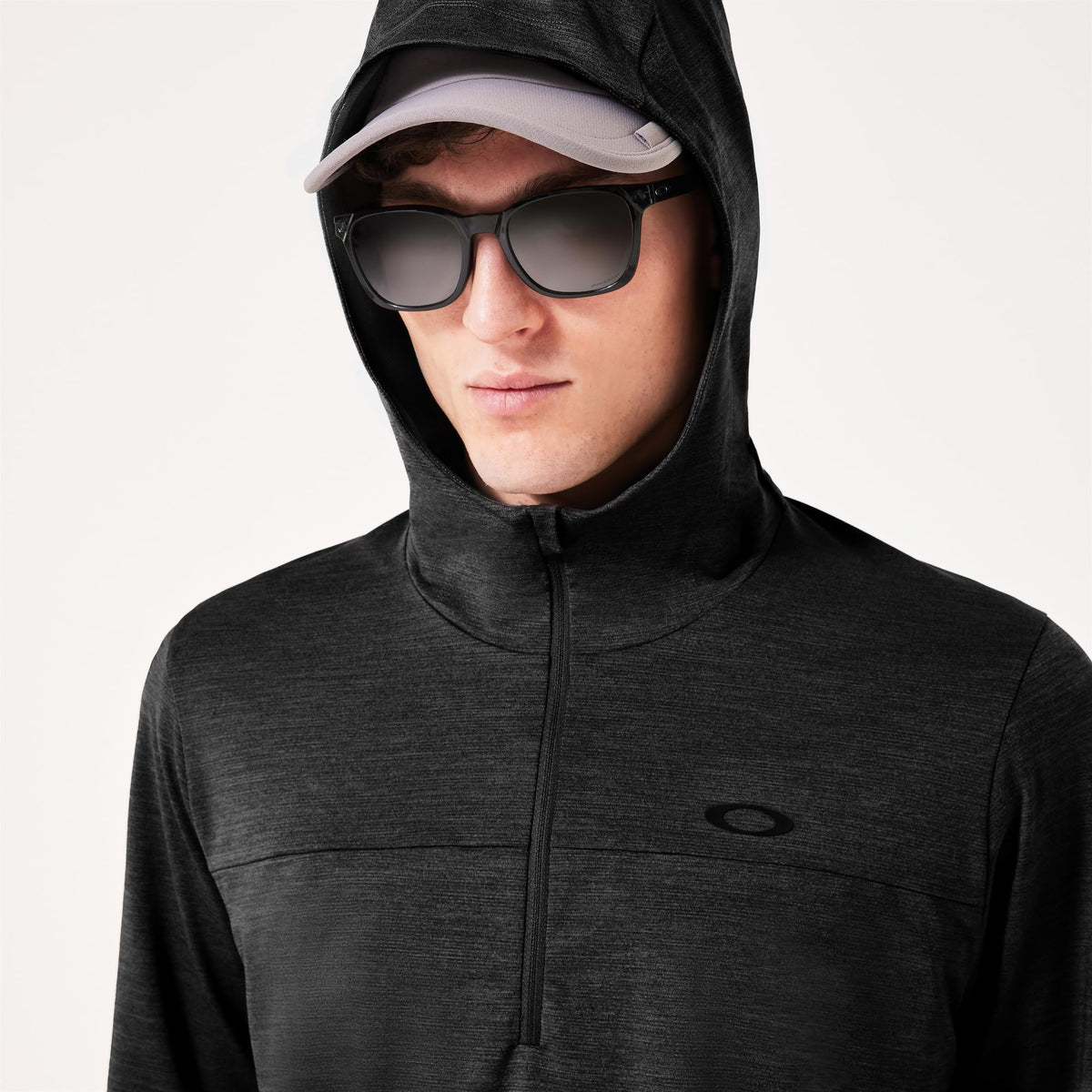 Men's black heather hoodie close-up with adjustable hood, front zipper, chest logo