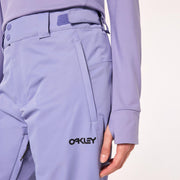 Light blue insulated ski pants close-up with Oakley logo and side pocket