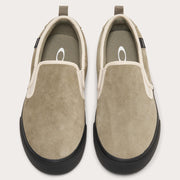 Pair of tan suede slip-on sneakers with elastic gore and black rubber soles