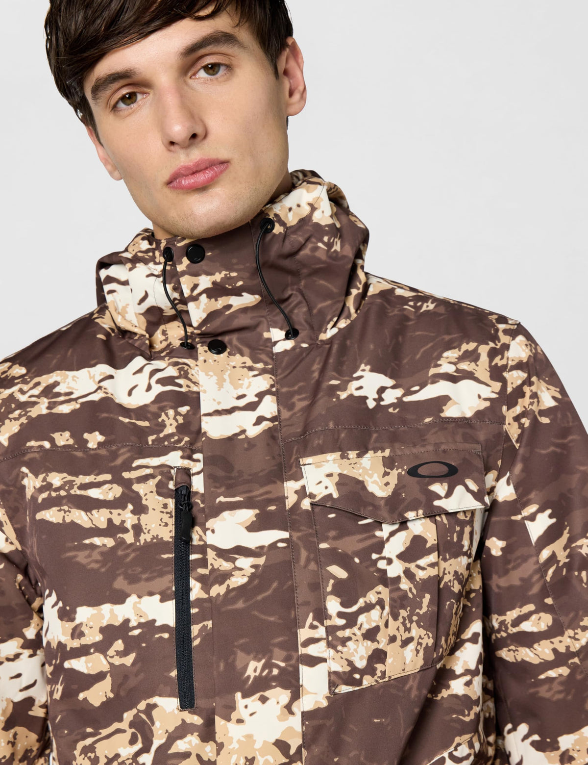 Oakley insulated jacket in brown-and-tan camo, hooded collar, zip, chest pocket