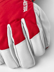 Red ski gloves with light gray leather palms and padded fingers with white stitching