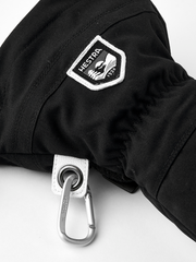 Black ski mitten with Hestra shield patch and metal carabiner wrist clip