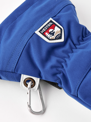 Blue ski mitten with HESTRA shield patch and metal carabiner clip on cuff