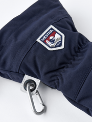 Navy ski mitten with Hestra patch and carabiner clip on the cuff