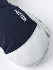 Dark navy and white ski mitten with embroidered HESTRA logo on back