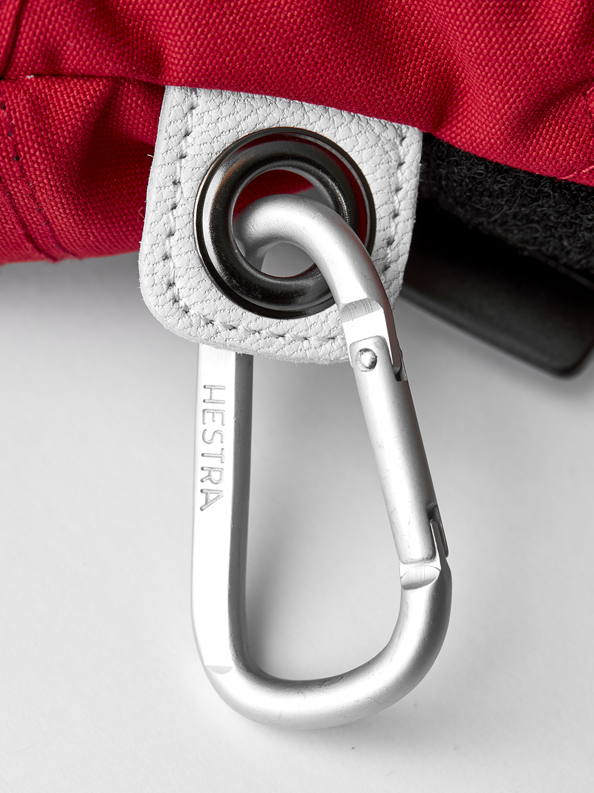 Red and white ski mitten wrist strap with metal carabiner