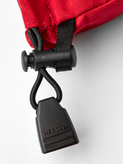 Red ski mitten cuff with black carabiner and locking strap hardware